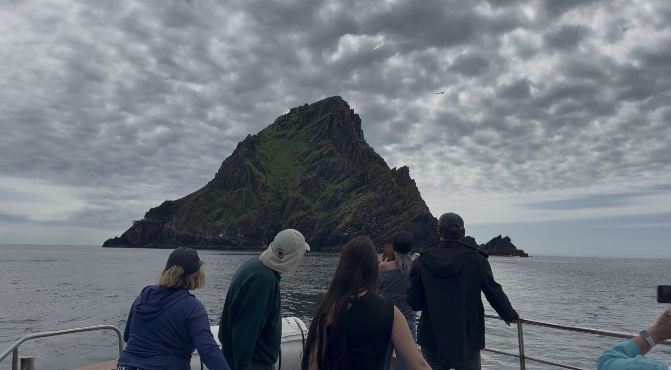 Group of guests looking toward Skellig Michael