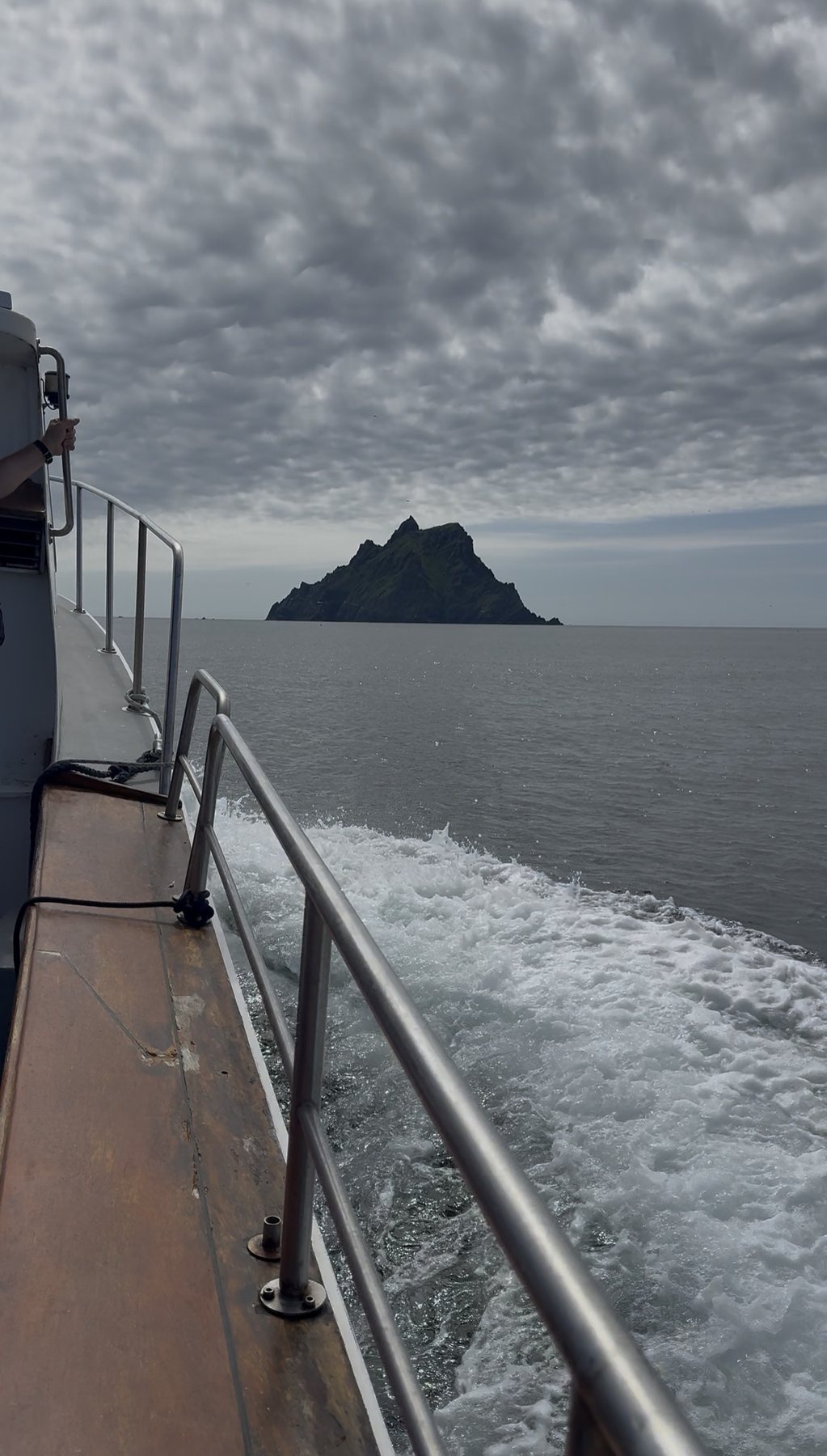 Boat wake on the Atlantic with Skellig rocks ahead